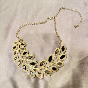 Gold and Black Statement Necklace with Intricate Design